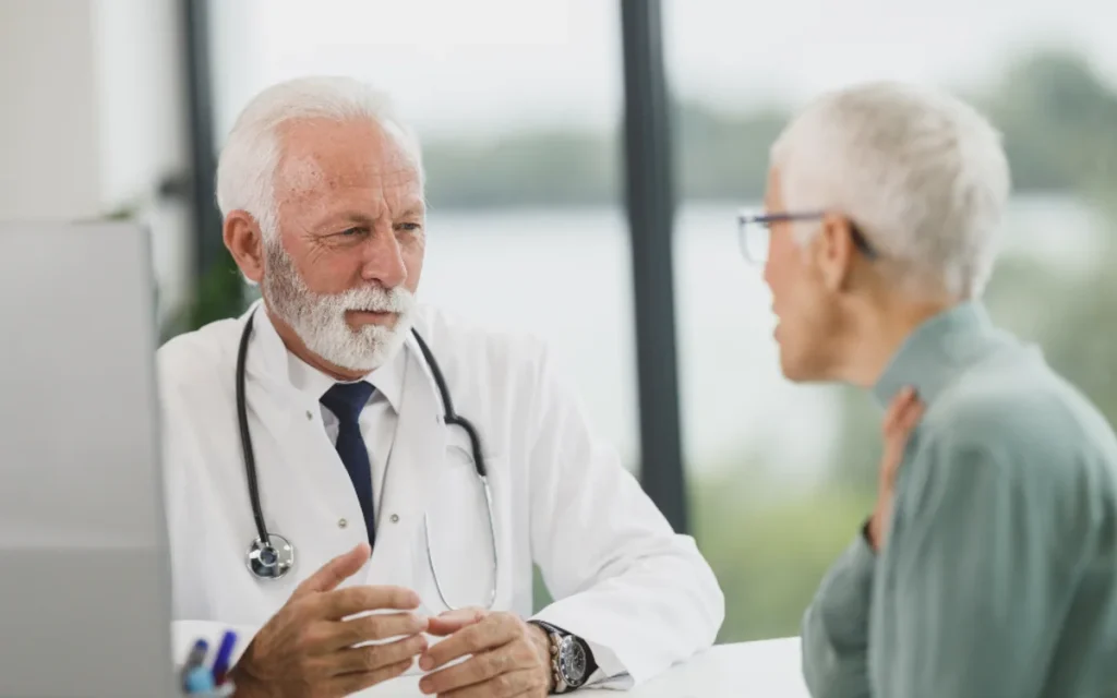 A clinician listening to a patient