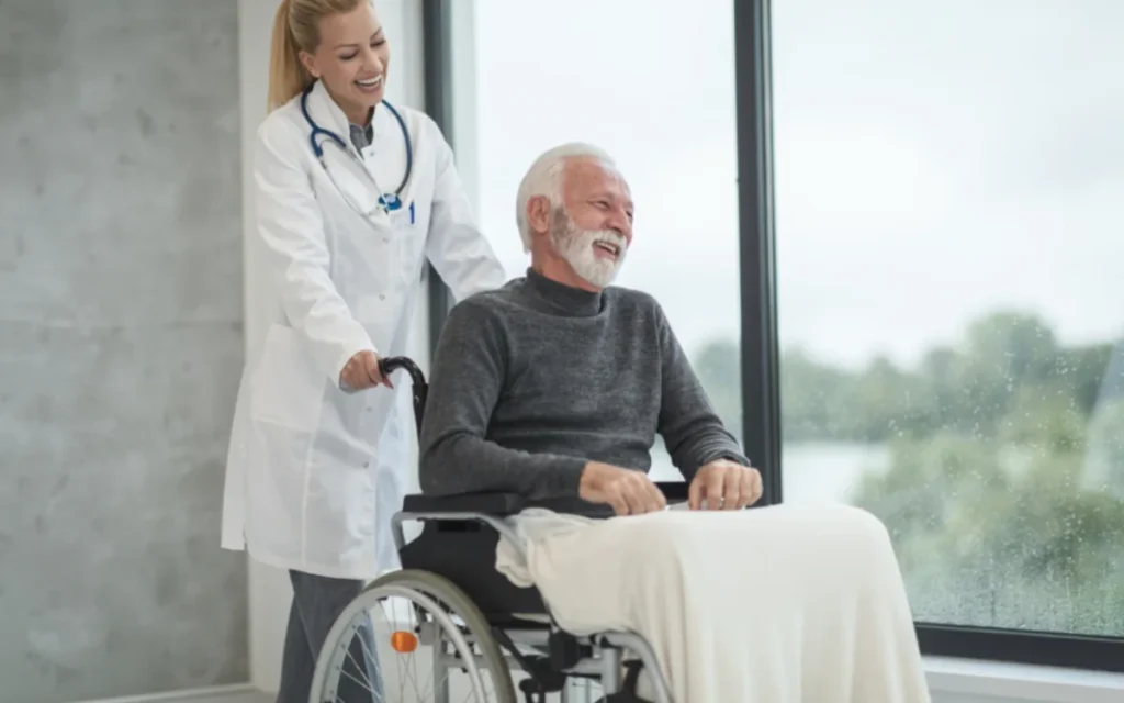 A nurse assisting a patient in a wheelchair