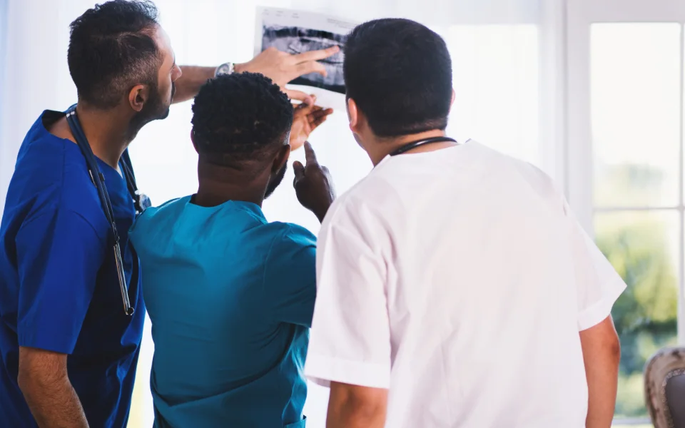 Clinicians reviewing a scan